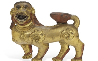 A GILT-BRONZE REPOUSSÉ PLAQUE OF A LION, TIBET, 16TH CENTURY