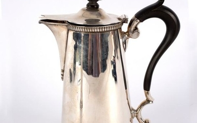 A silver hot water jug, Sheffield 1918, initialled H