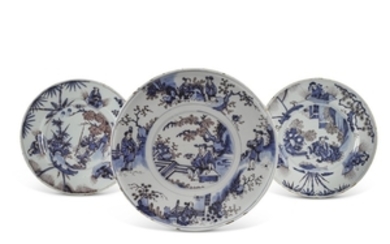 A Dutch Delft blue and manganese footed tazza and two plates