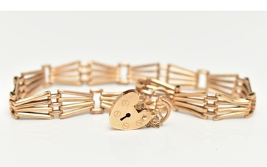 A 9CT YELLOW GOLD BRACELET WITH PADLOCK CLASP, the plain pol...
