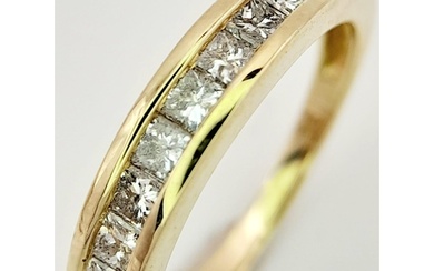 A 9K Yellow Gold Diamond Set Half Eternity Ring. 0.40ctw, Si...