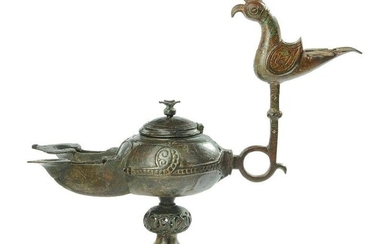 A BRONZE OIL LAMP, KHORASAN, EASTERN PERSIA, 12TH CENTURY