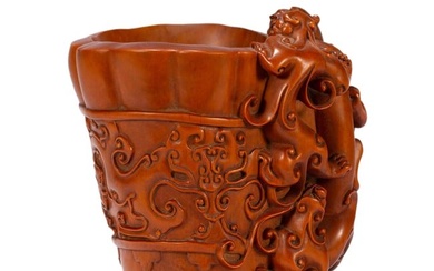 A CHINESE CARVED BOXWOOD DRAGON CUP