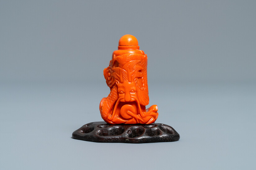 A Chinese carved red coral snuff bottle with a dragon, Republic
