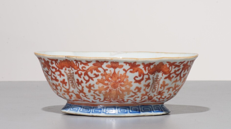 A Chinese iron-red 'auspicious' footed bowl, H 6,5 cm