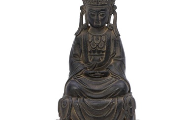 A Chinese patinated bronze Guanyin seated on a throne. Ming style and...