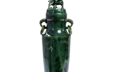 A Chinese spinach jade vase and cover Late Qing dynasty Of slender...