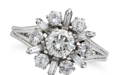 A DIAMOND CLUSTER RING set with a round brilliant cut diamond in a cluster of baguette and round