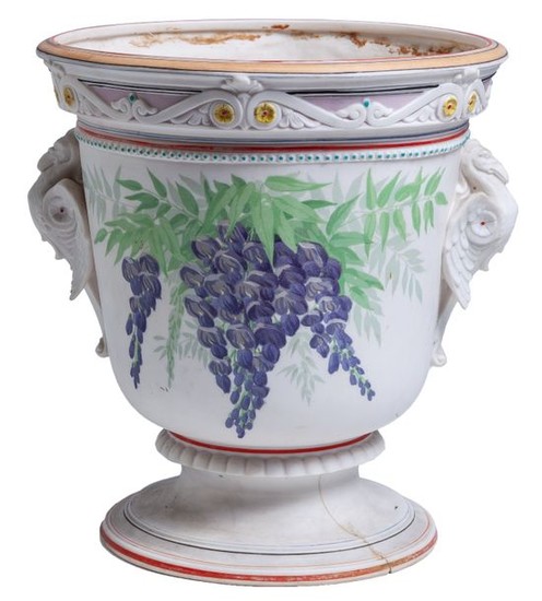 A French polychrome-decorated biscuit porcelain vase with vines....
