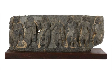 A GREY SCHIST RELIEF WITH BUDDHIST MONKS CARRYING WATER FLASKS Ancient region of Gandhara, 2nd - 3rd century