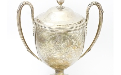 A Geo III silver twin handled presentation trophy cup and co...