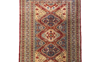 A HAND KNOTTED PERSIAN WOOL RUG, EARLY 20TH CENTURY, probabl...