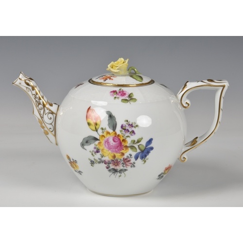 A Herend Teapot, white glaze with hand painted floral design...