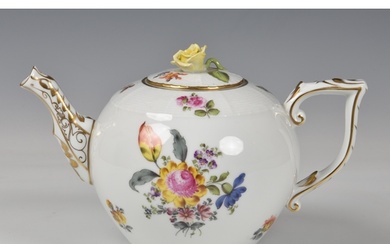 A Herend Teapot, white glaze with hand painted floral design...