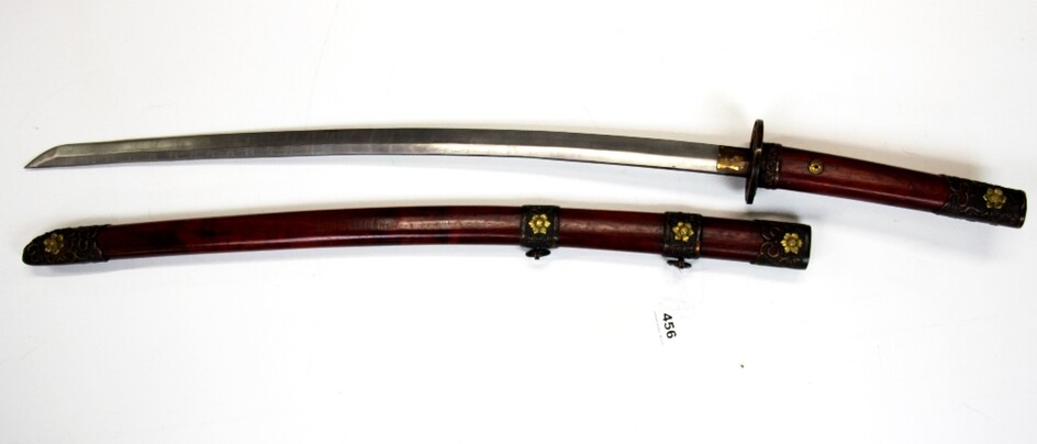 A Japanese Daito sword, blade L. 69cm. Showing 'Makuma - Hada' with bronze and stained wooden scabbard and hilt, Overall L. 100cm.