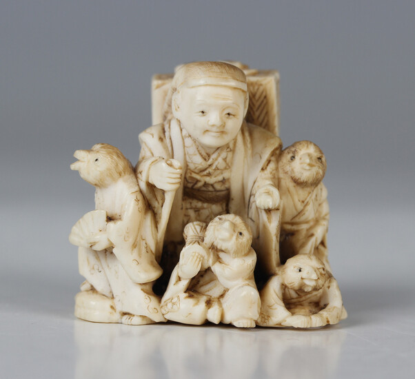 A Japanese carved and stained ivory netsuke, Meiji/Taisho period, modelled to represent the fable Sh