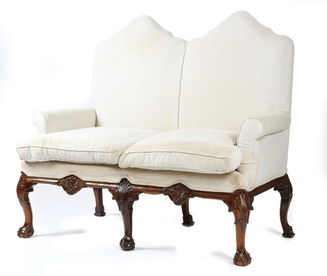 A MAHOGANY TWO SEATER SETTEE IN GEORGE II...