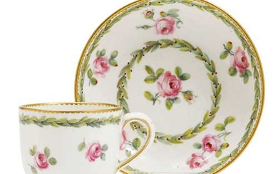 A PAIR OF CUPS AND SAUCERS DECORATED WITH ROSES