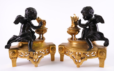A PAIR OF LOUIS XVI STYLE BRONZE MOUNTED GILT-METAL CHENETS (2)