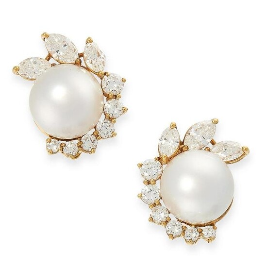A PAIR OF PEARL AND DIAMOND EARRINGS each set with a