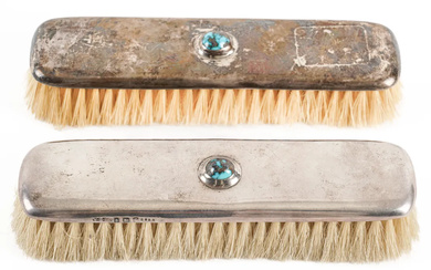 A PAIR OF SILVER MOUNTED AND TURQUOISE MATRIX CLOTHES BRUSHES (2)