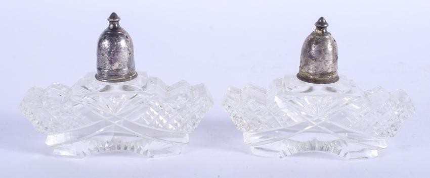 A PAIR OF VINTAGE SILVER TOPPED GLASS SALTS. 9 cm wide.