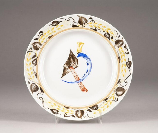 A PORCELAIN PLATE WITH HAMMER AND SICKLE