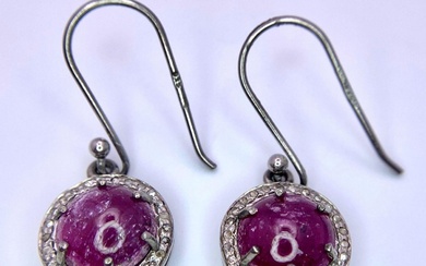 A Pair of Ruby and Diamond 925 Silver Earrings....