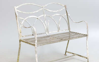 A REGENCY STYLE WHITE PAINTED WROUGHT METAL STRAPWORK GARDEN BENCH SEAT.