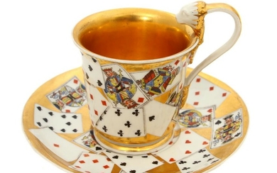 A RUSSIAN PORCELAIN CUP AND SAUCER W/ PLAYING CARDS