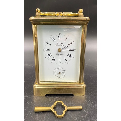 A carriage clock with repeater movement and alarm with L'Epe...