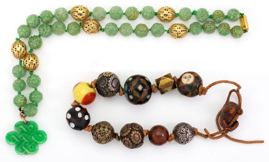 A carved jadeite jade bead necklace and an oriental bead bracelet, the necklace composed of carved jade beads with pierced spherical spacers, Chinese marks to clasp, suspending an associated carved and pierced endless knot motif octofoil dyed...