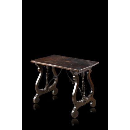 A carved wooden table (cm 66,54,5x42,5) (defects)