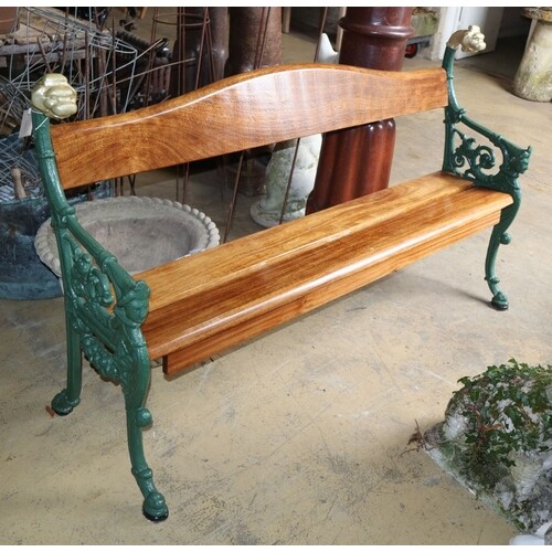A cast iron and teak garden bench marked Carabas, W.160cm, D...