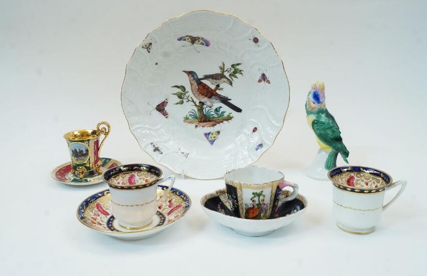 A collection of Continental porcelain, comprising: a Meissen porcelain dish, 19th century, painted with birds on a branch and with scattered insects within a Neuozier border and gilt rim, having crossed swords mark in underglaze blue, 26cm...