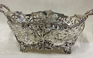 A fine Victorian silver basket with pierced decoration.