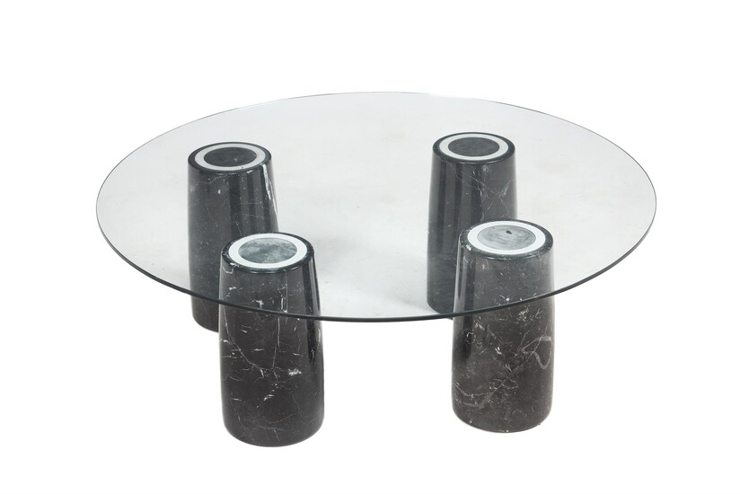A glass and marble low centre table