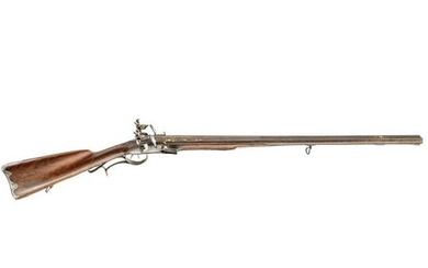 A gold-damascened flintlock side-by-side shotgun by
