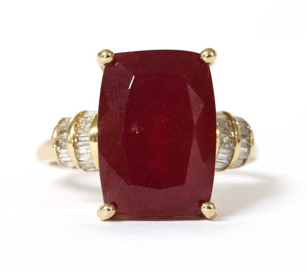 A gold fracture filled ruby and diamond ring