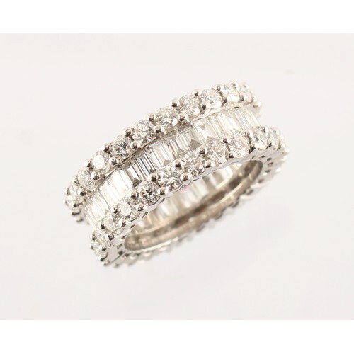 A good white gold diamond eternity ring, set with a ring of ...