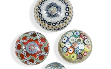 A group of four glass paperweights
