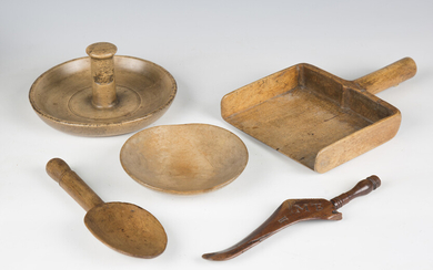 A group of mainly 19th century treen kitchenalia, including a grain scoop, various spoons, a nutcrac