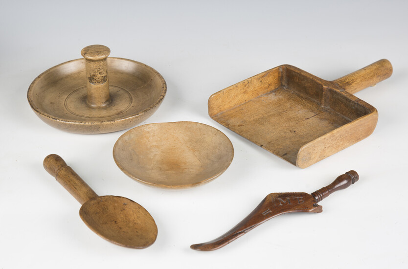 A group of mainly 19th century treen kitchenalia, including a grain scoop, various spoons, a nutcrac