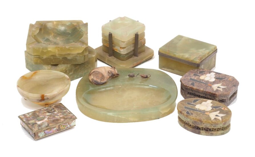 A group of onyx objects, mid 20th century, to include an ash-tray mounted with a model of a cat and two mice, 19cm wide, two large squared ash-trays, a 'stacked' set of ashtrays, 8cm high inclusive, and other similar wares (9)