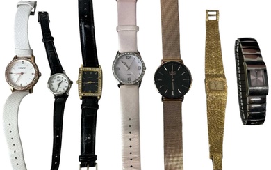 A group of seven modern lady's fashion watches including Kezzi,...