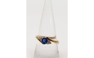 A hallmarked 9ct gold diamond and sapphire ring, gross weigh...