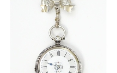 A ladies pocket watch with bow formed brooch hanger. The bro...