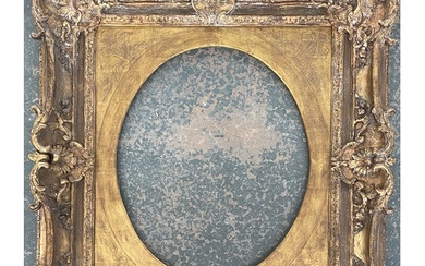 A large 19th century carved gilt gesso picture frame with la...