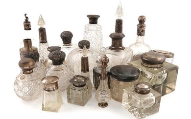 A large collection of silver-mounted bottles and jars,...