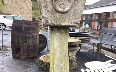 A large composition stone garden urn on square stepped moulded...